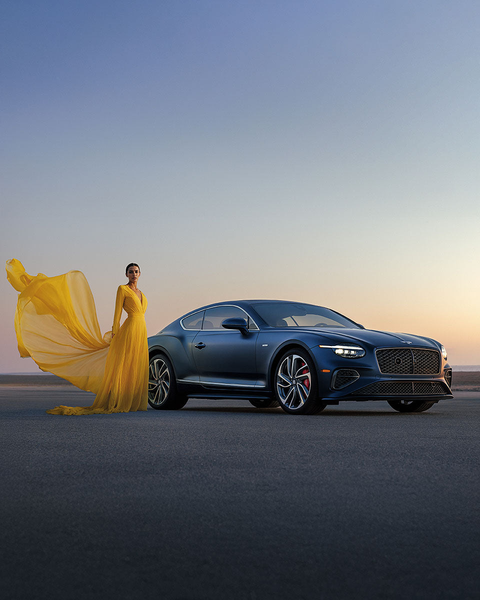 Side profile of a satin blue Bentley Continental GT on a studio plinth, by Niaz Uddin