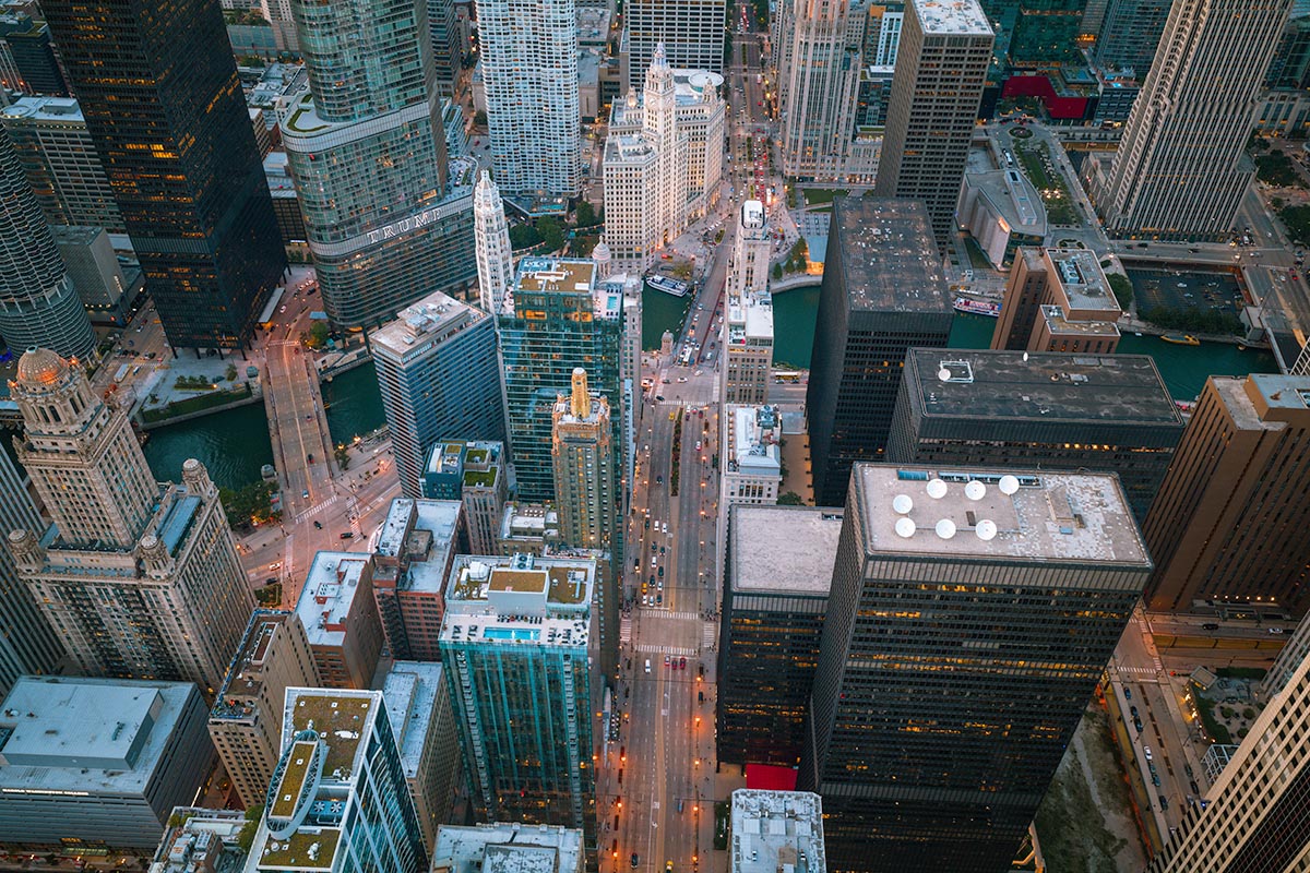 Top-down aerial view of Michigan Avenue crossing the Chicago River at the DuSable Bridge at dusk, start of the Magnificent Mile, by Niaz Uddin