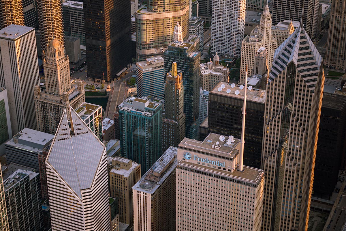 Golden-hour aerial of the Chicago Loop featuring Two Prudential Plaza and the Prudential building, by Niaz Uddin