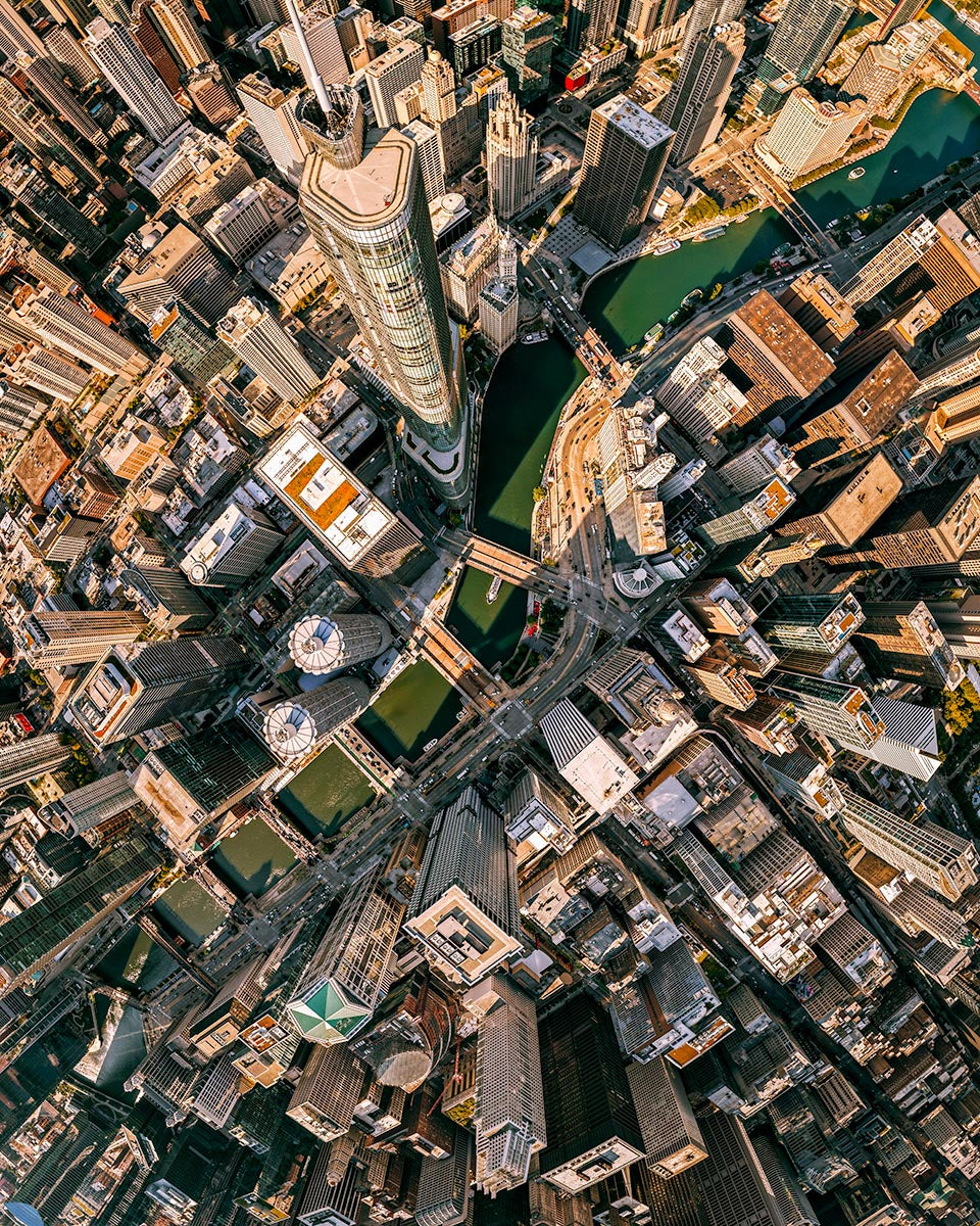 Top-down aerial view of downtown Chicago skyscrapers and the Chicago River