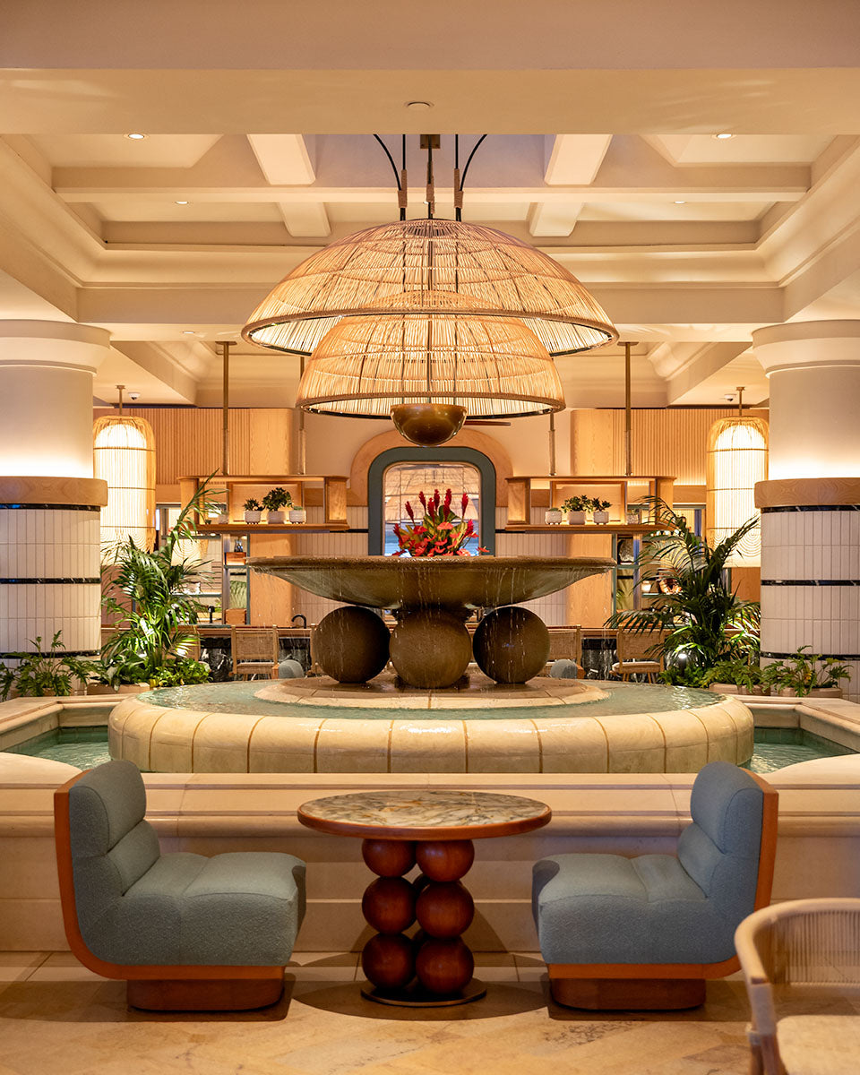 Central lobby fountain framed by twin woven rattan dome pendants at Four Seasons Resort Maui, by Niaz Uddin
