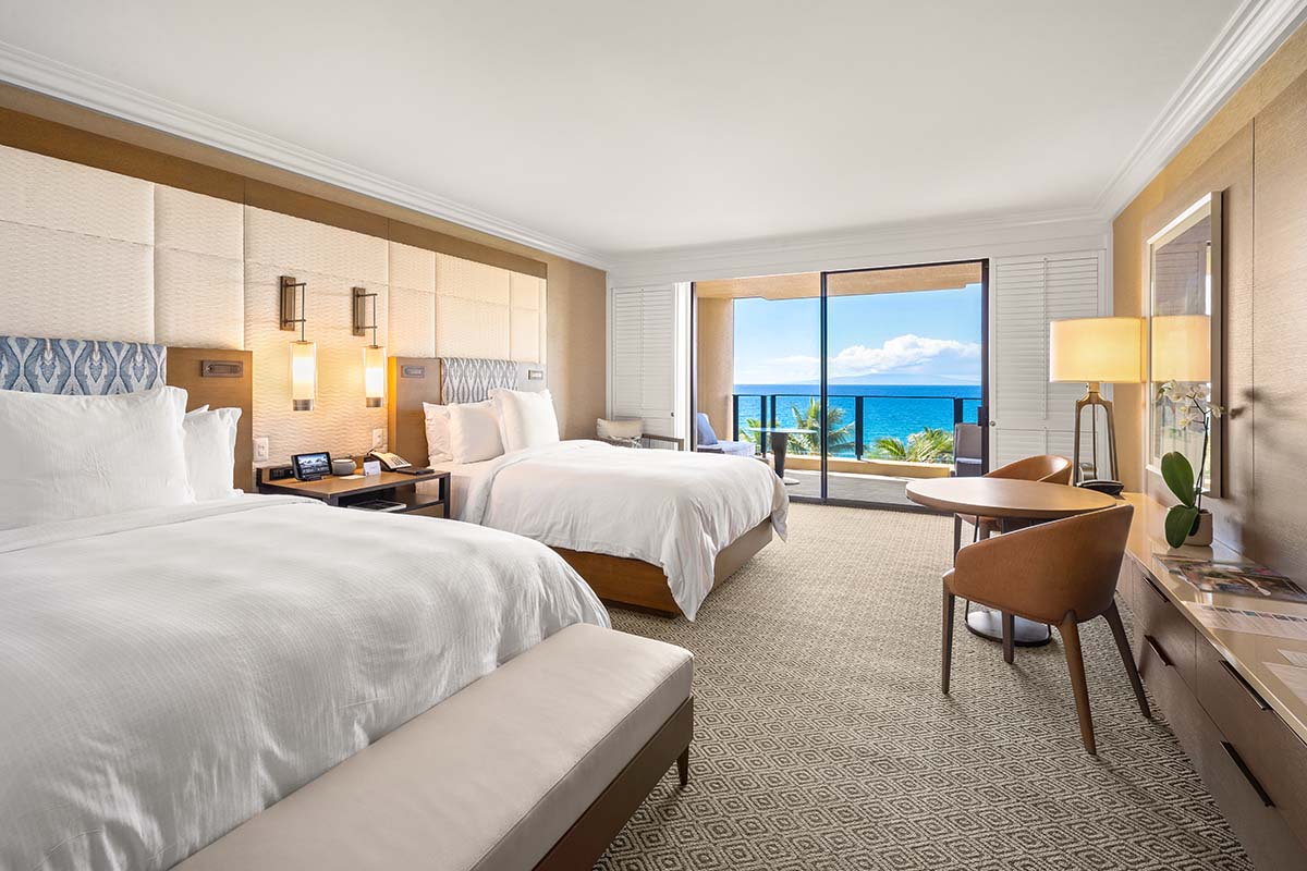 Ocean-view guest room with two queen beds and a lanai overlooking the water at Four Seasons Resort Maui, by Niaz Uddin