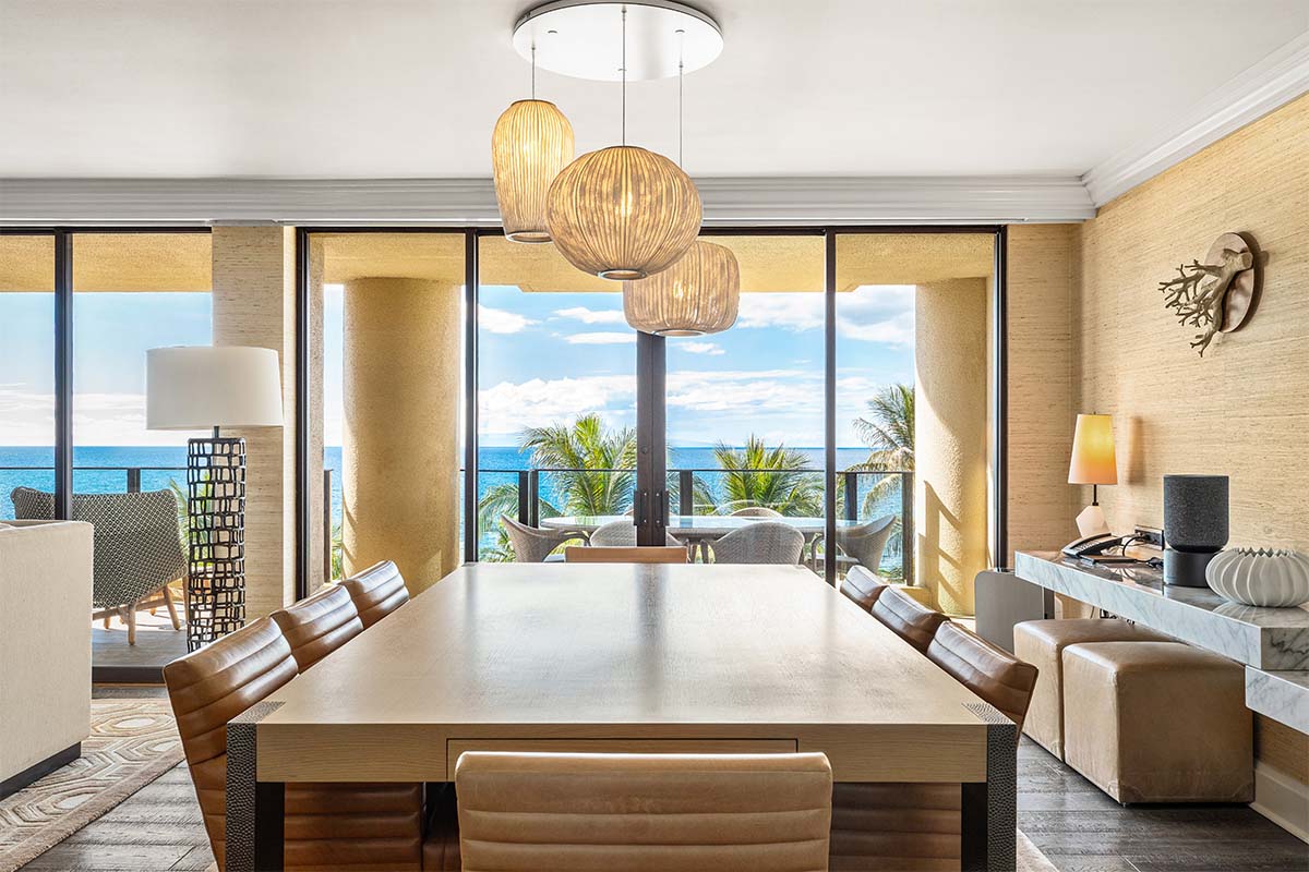 Suite dining room with rattan pendants and floor-to-ceiling ocean views at Four Seasons Resort Maui, by Niaz Uddin