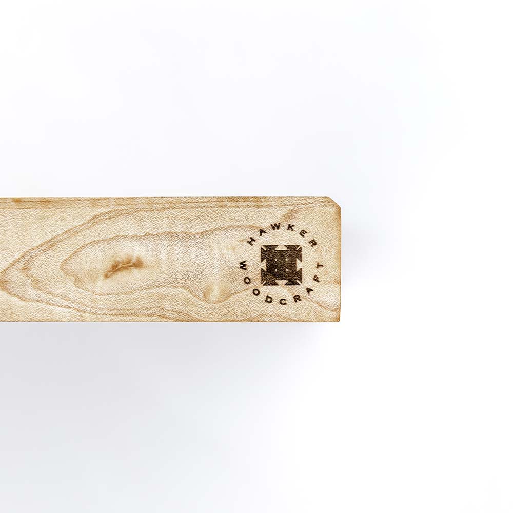 Close-up of the Hawker Woodcraft branded logo stamp burned into the edge of a maple board, by Niaz Uddin