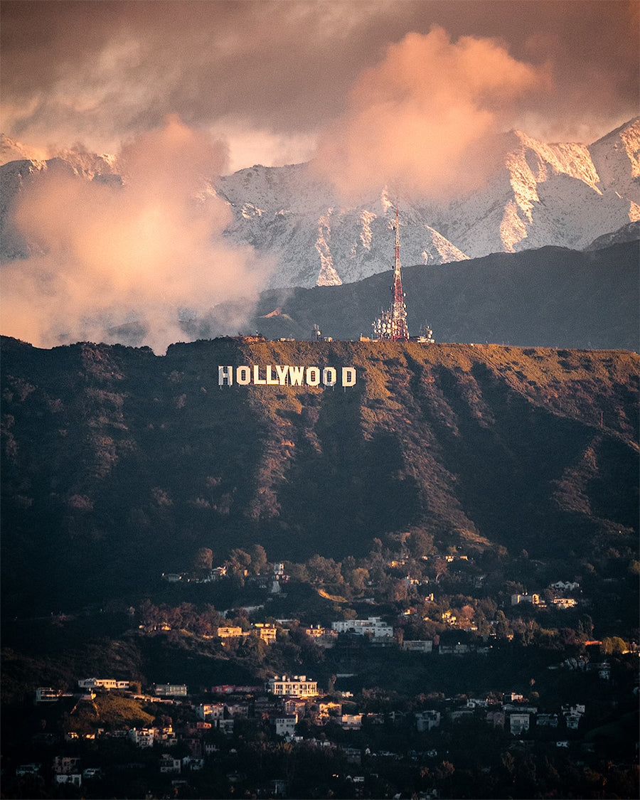 Snow on the San Gabriel Mountains behind the Hollywood Sign at sunrise, Los Angeles.