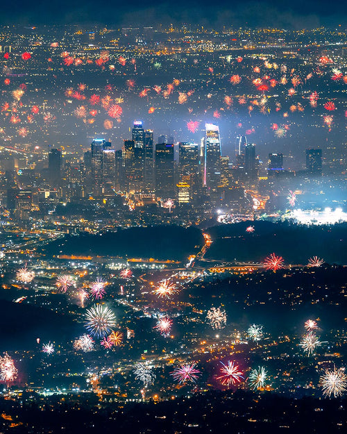 Thousands of Fourth of July fireworks bursting across the Los Angeles basin with the downtown skyline at night, seen from Mount Wilson.