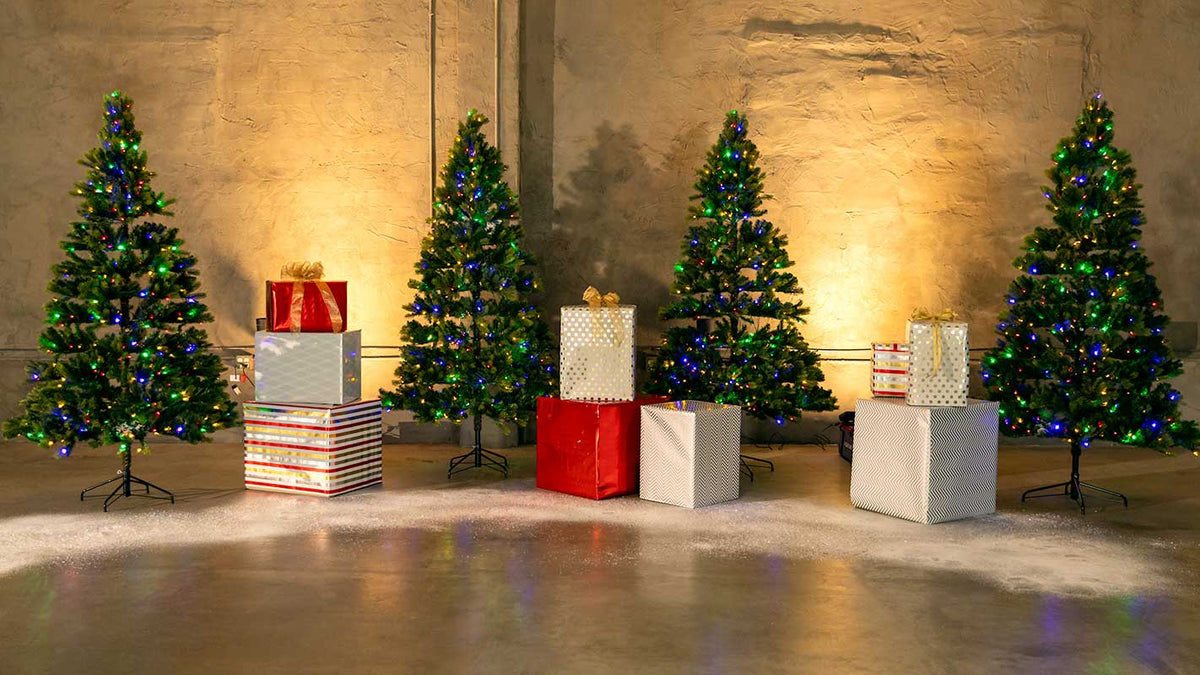 The practical Christmas set for the McLaren holiday commercial, built on stage with lit trees, gifts and snow