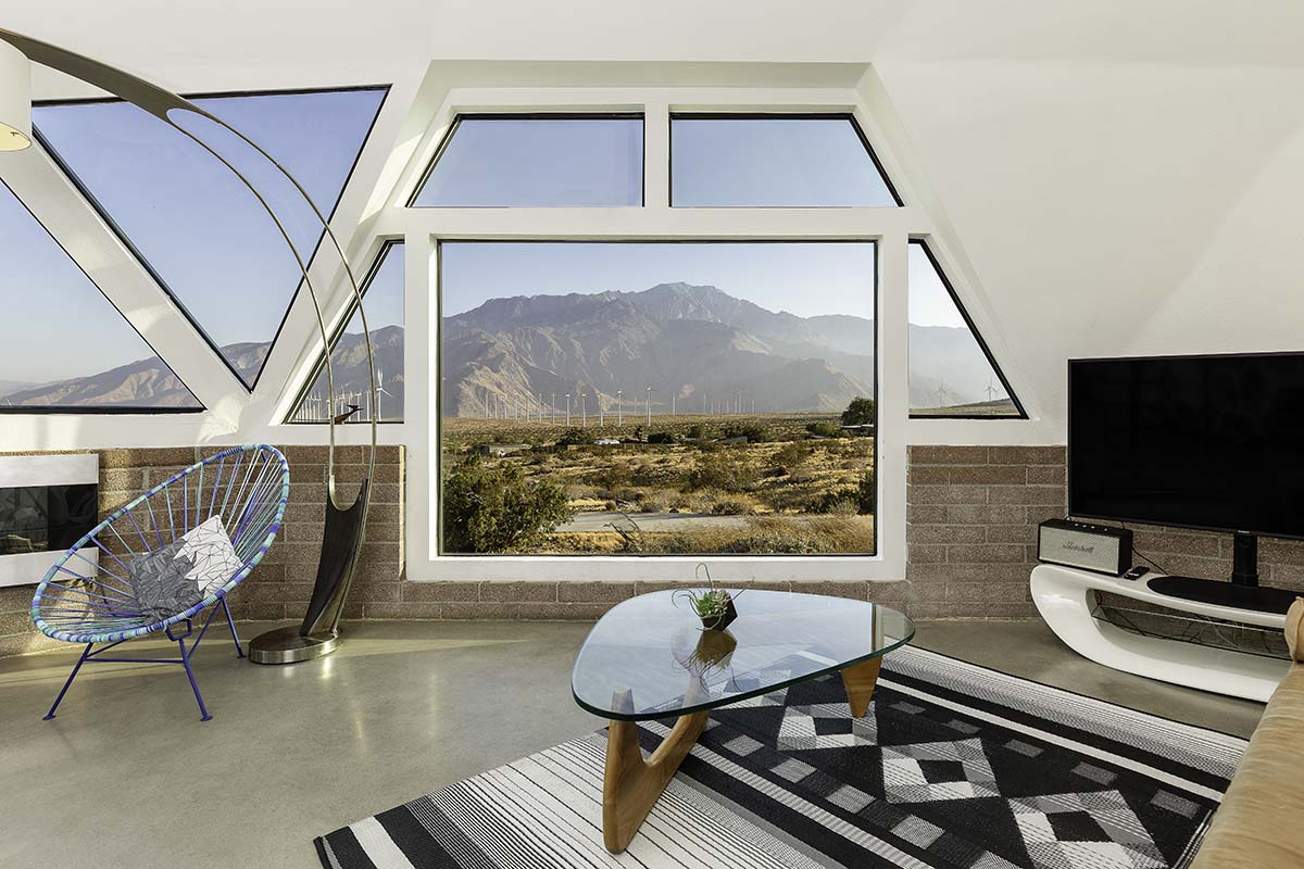Living room with triangular windows framing the San Jacinto peak in the Palm Springs dome house, by Niaz Uddin