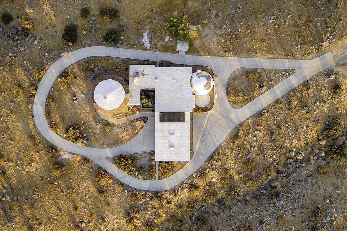 Top-down aerial of the geodesic dome house and its curving desert driveway, near Palm Springs, by Niaz Uddin