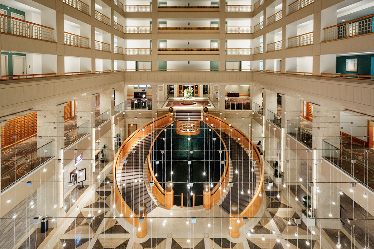 Grand atrium lobby and oval staircase at Renaissance Esmeralda Resort & Spa in Indian Wells