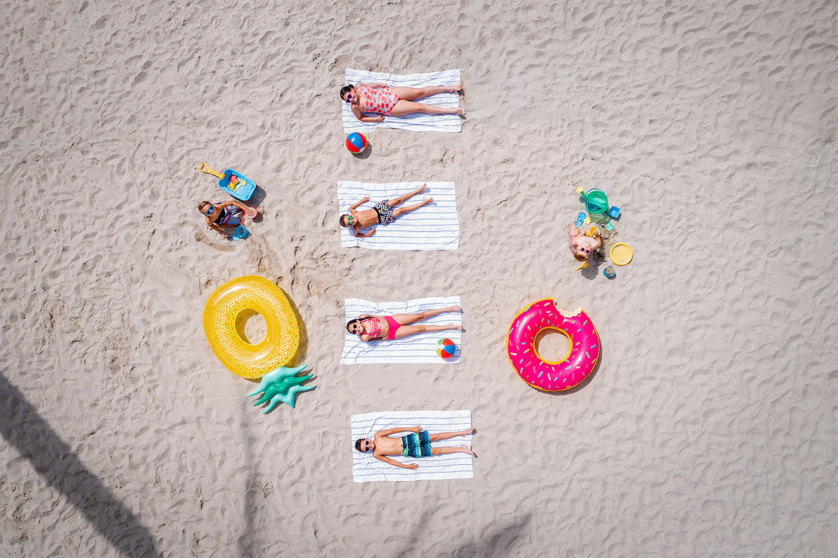 Aerial of guests sunbathing on the sand beach-entry pool with floats at Renaissance Esmeralda Resort & Spa in Indian Wells