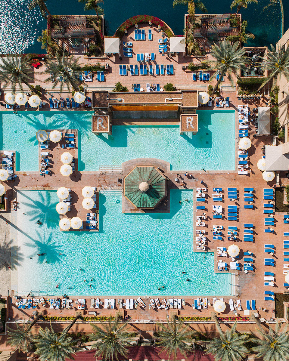 Overhead aerial of the main resort pool with R initials and fountain at Renaissance Esmeralda Resort & Spa in Indian Wells
