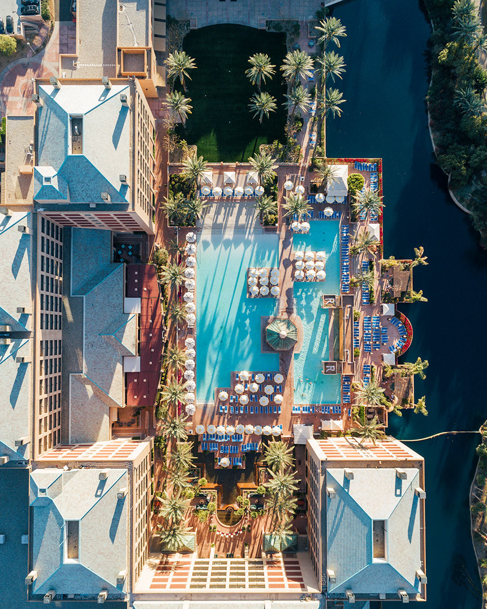 Overhead aerial of the pools, palm trees and lake at Renaissance Esmeralda Resort & Spa in Indian Wells