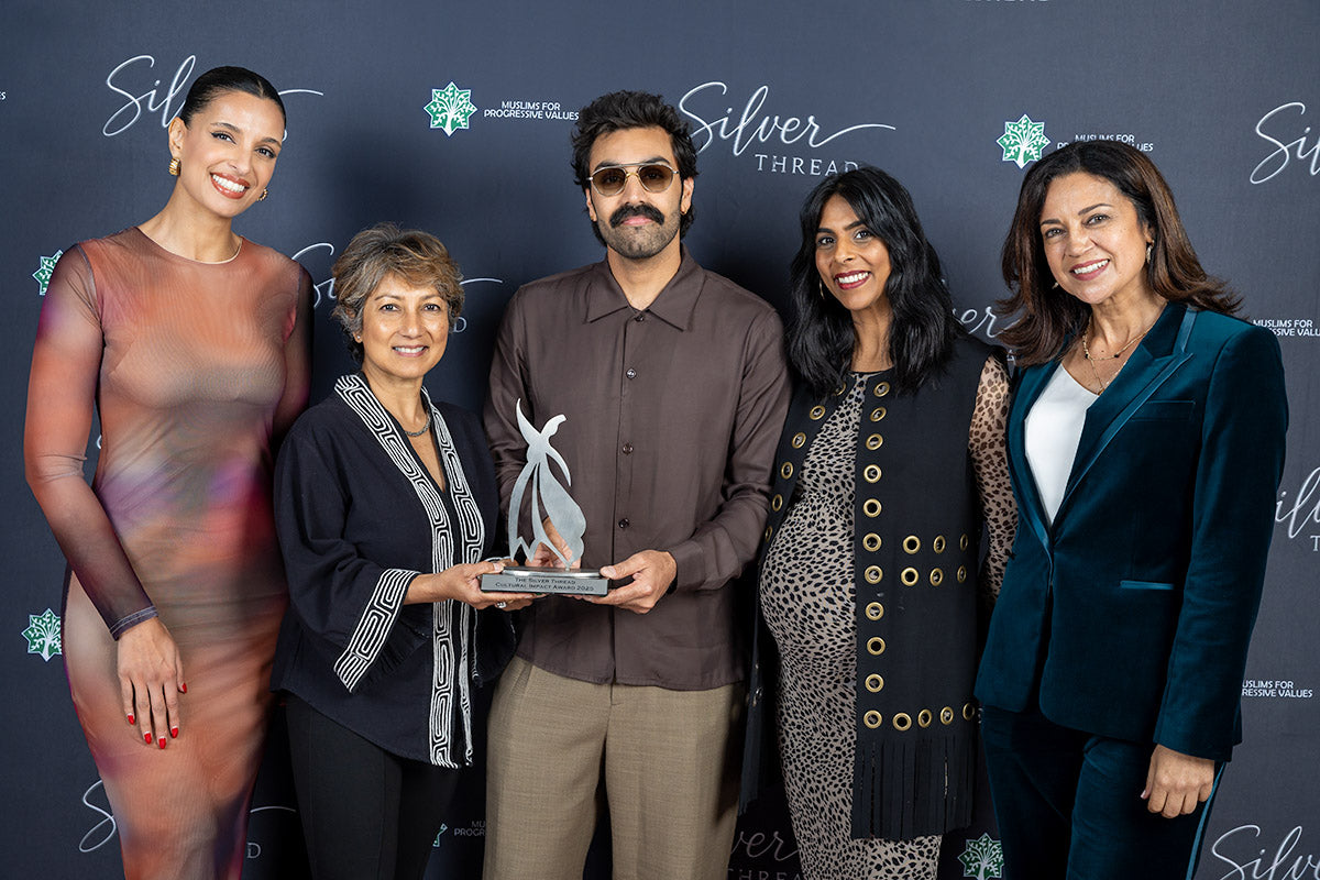 Honoree and hosts holding the Silver Thread Cultural Impact Award 2025 trophy
