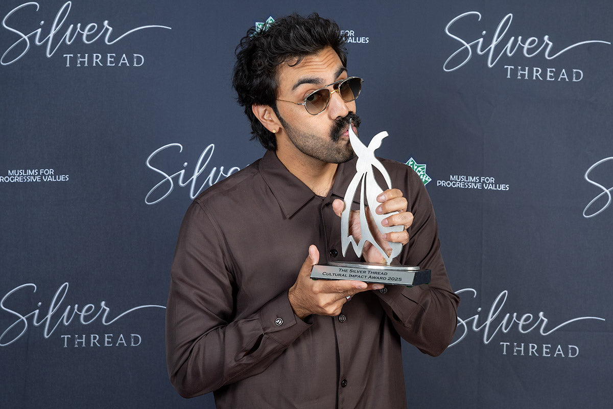 Honoree holding the Silver Thread Cultural Impact Award 2025 trophy