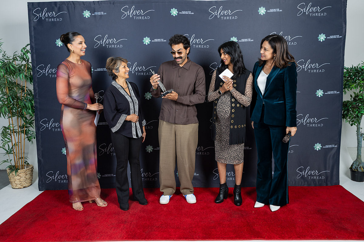 The Silver Thread Cultural Impact Award being presented to the honoree on the red carpet